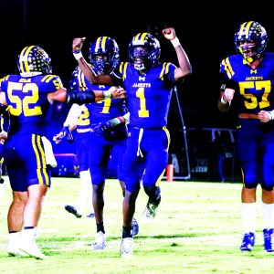 J. T. Bryant (1) celebrates his interception along with Tye Rea (52), J.J Benjamin (7) & Kenneth Kidd (57)